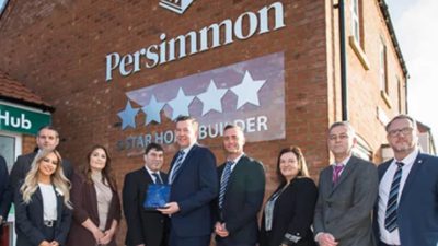 Investor in Sales: Persimmon’s Ed McCoy and Craig Timmins (centre and centre right) alongside colleagues receive the award from the ISP’s Patrick Joiner (centre left).